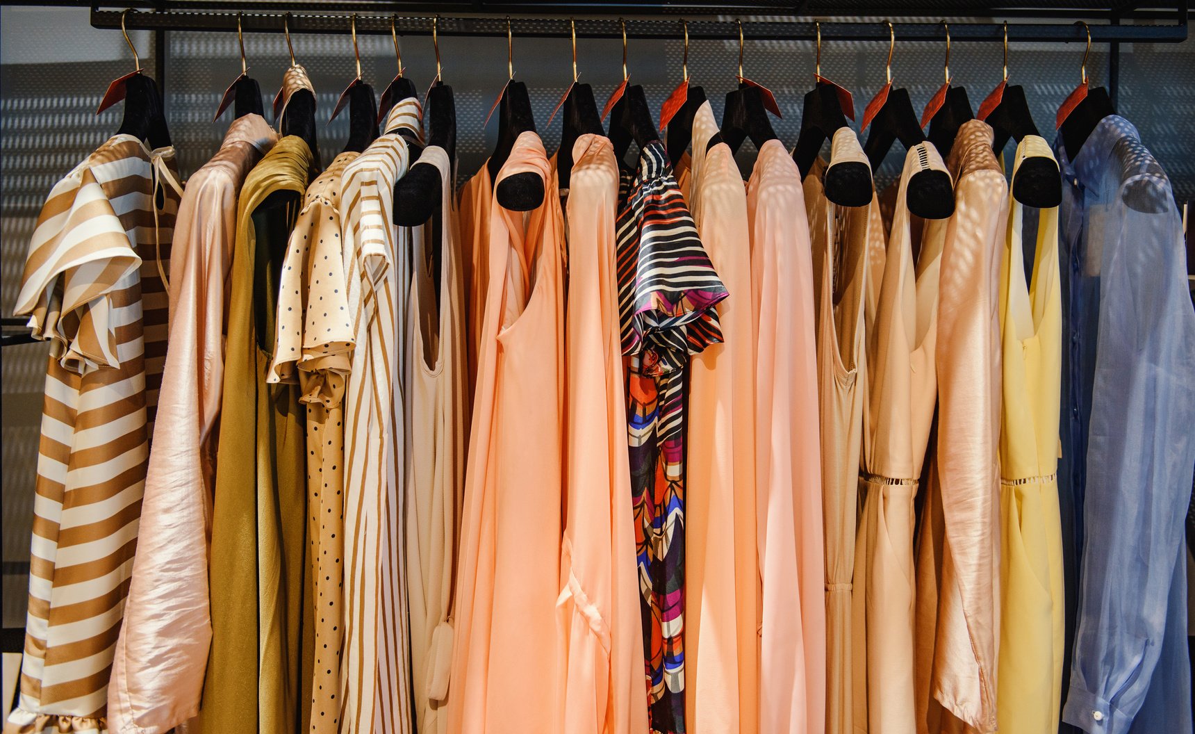 Clothes on racks in a fashion boutique